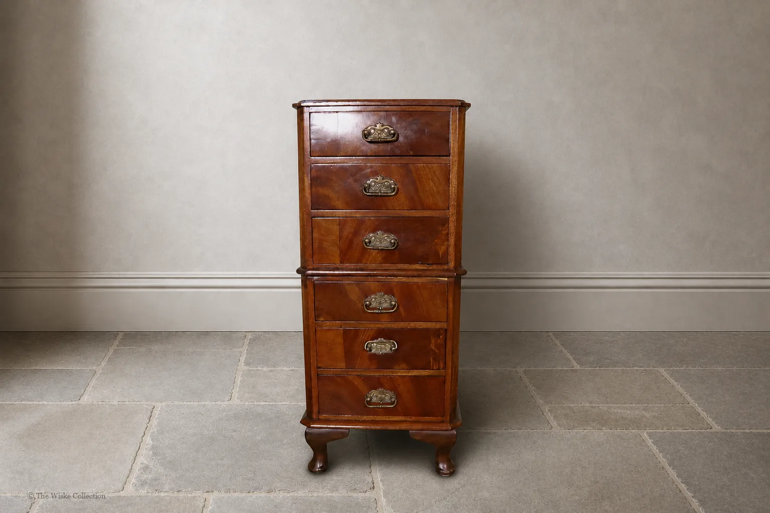 Early 20th-century walnut miniature chest of small proportions, with moulded rectangular top and clipped corners, six graduated drawers fitted with brass swing handles, and short cabriole feet; 67cm high, 28cm wide, 22cm deep - Plate 1