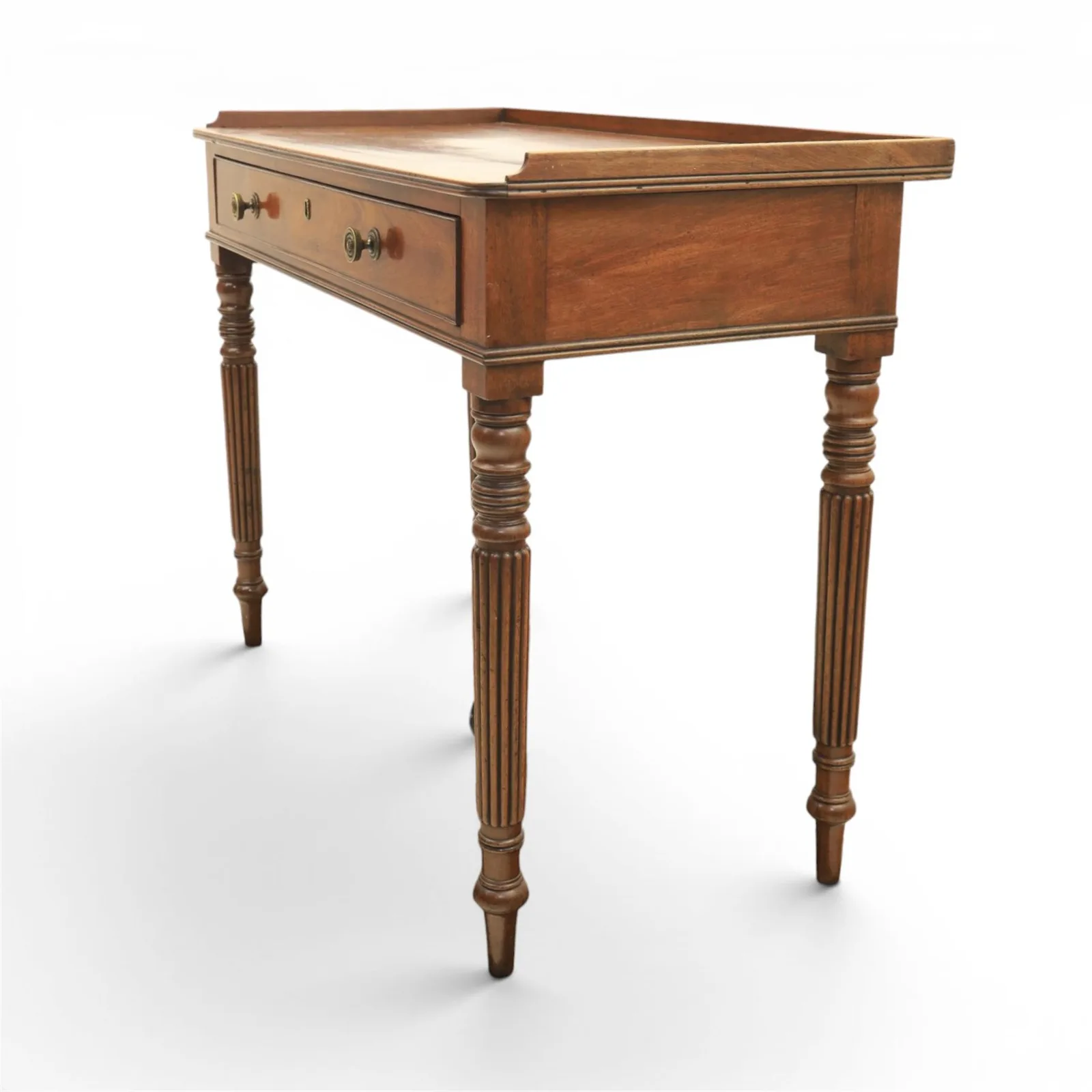 Regency English mahogany dressing table, stamped Gillow, early 19th century; rectangular top with three-quarter gallery above a frieze drawer with twin brass knobs; raised on turned and reeded supports thumbnail 3