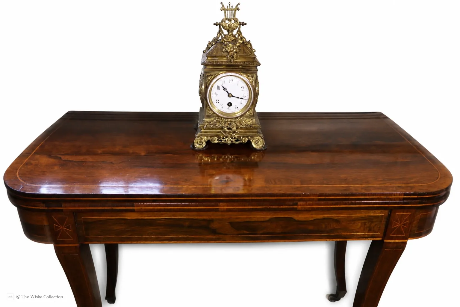 Early 20th-century Neoclassical brass mantel clock with white enamel dial, French timepiece movement and recoil anchor escapement; case crowned by lyre finial, trailing garlands and wreaths, on scroll feet thumbnail 13