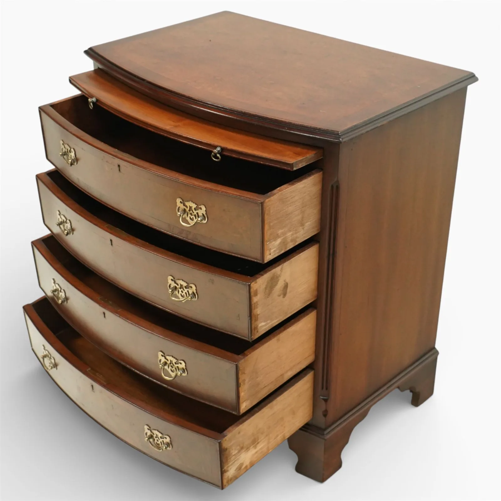 20th century Queen Anne style burr walnut bow fronted chest of drawers, moulded rectangular top above a brushing slide, four graduated drawers fitted with pierced brass handles, flanked by canted corners, raised on shaped bracket feet thumbnail 3