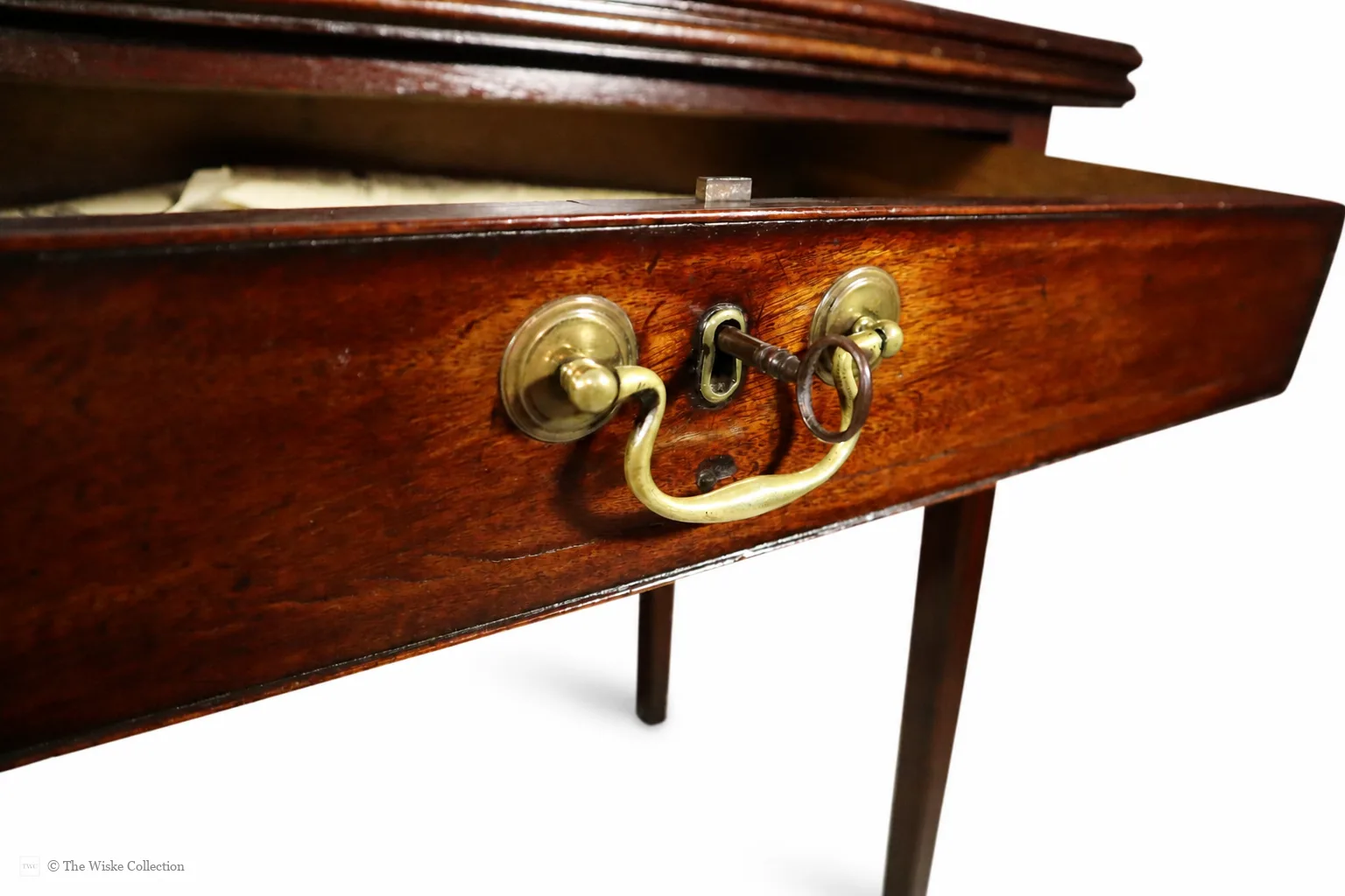 Georgian mahogany turnover-top tea table; rectangular hinged leaf unfolds to a square surface; single frieze drawer with brass swan-neck handle and escutcheon; square tapering legs thumbnail 7