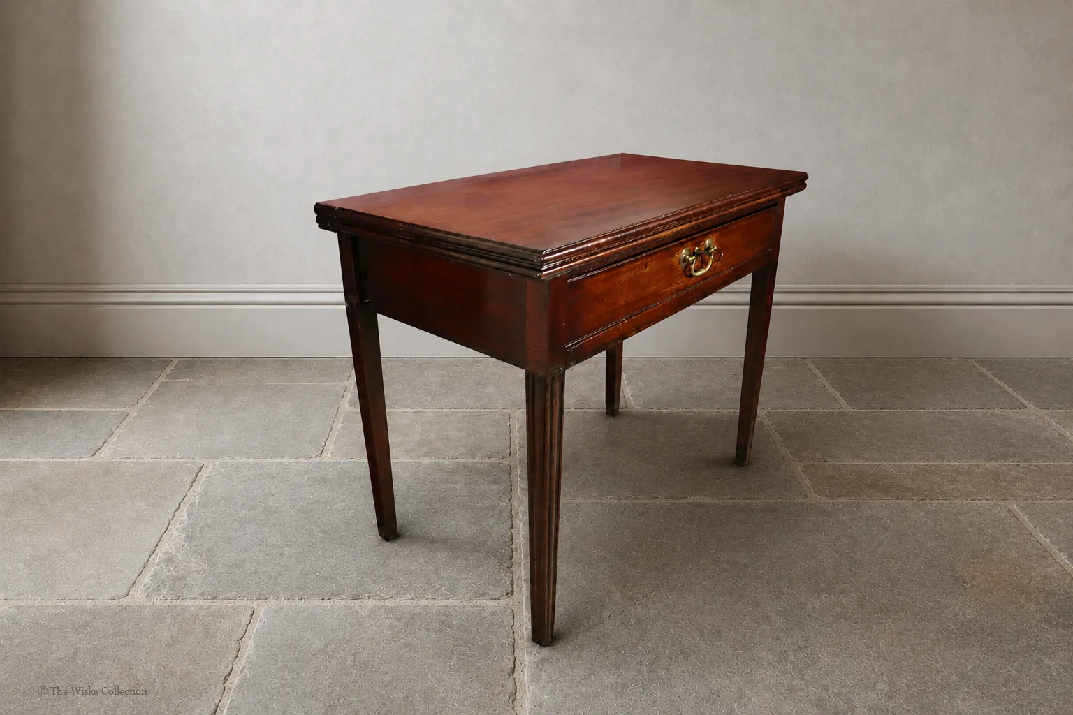Georgian mahogany turnover-top tea table; rectangular hinged leaf unfolds to a square surface; single frieze drawer with brass swan-neck handle and escutcheon; square tapering legs thumbnail 8