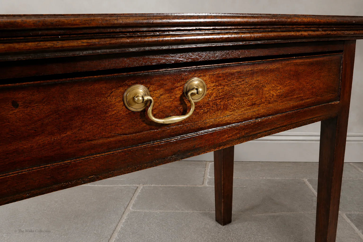 Georgian mahogany turnover-top tea table; rectangular hinged leaf unfolds to a square surface; single frieze drawer with brass swan-neck handle and escutcheon; square tapering legs thumbnail 3