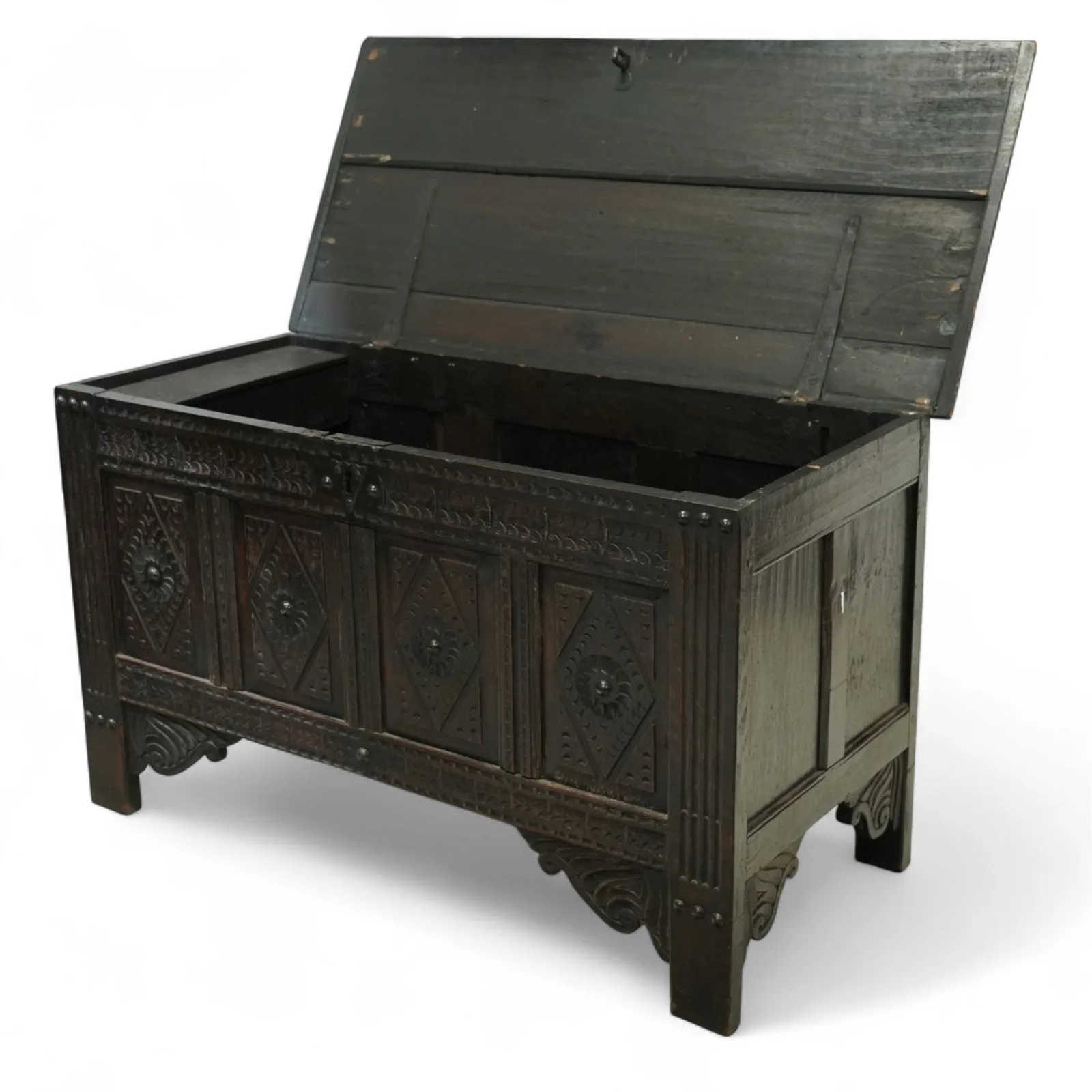 19th century carved oak coffer, rectangular plank top above a four-panel front carved with lozenges and flowerhead motifs, shaped lower apron and stile feet thumbnail 3