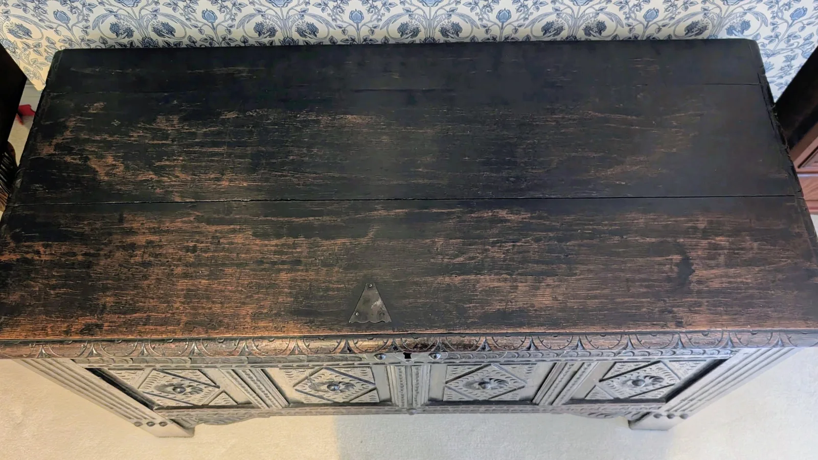 19th-century carved oak coffer; rectangular plank top over a four-panel front with lozenge and flowerhead carving, shaped lower apron, stile feet; sturdy provincial work thumbnail 13