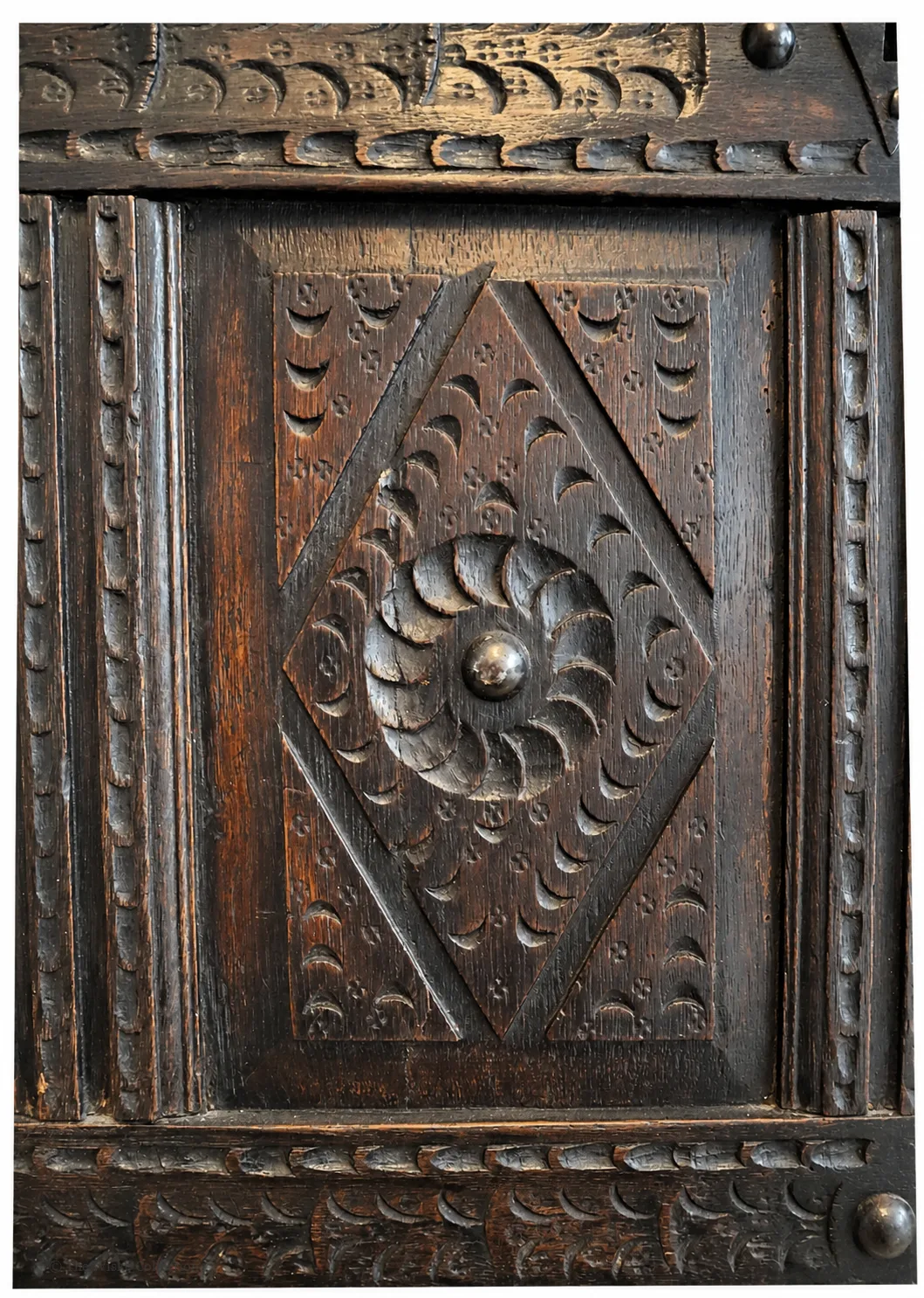 19th-century carved oak coffer; rectangular plank top over a four-panel front with lozenge and flowerhead carving, shaped lower apron, stile feet; sturdy provincial work thumbnail 5
