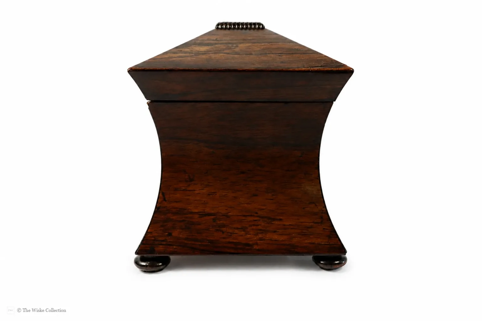 Early 19th-century rosewood tea caddy of waisted sarcophagus form, with twin compartments, brass keyplate, and compressed bun feet; 17cm high, 22cm wide thumbnail 3