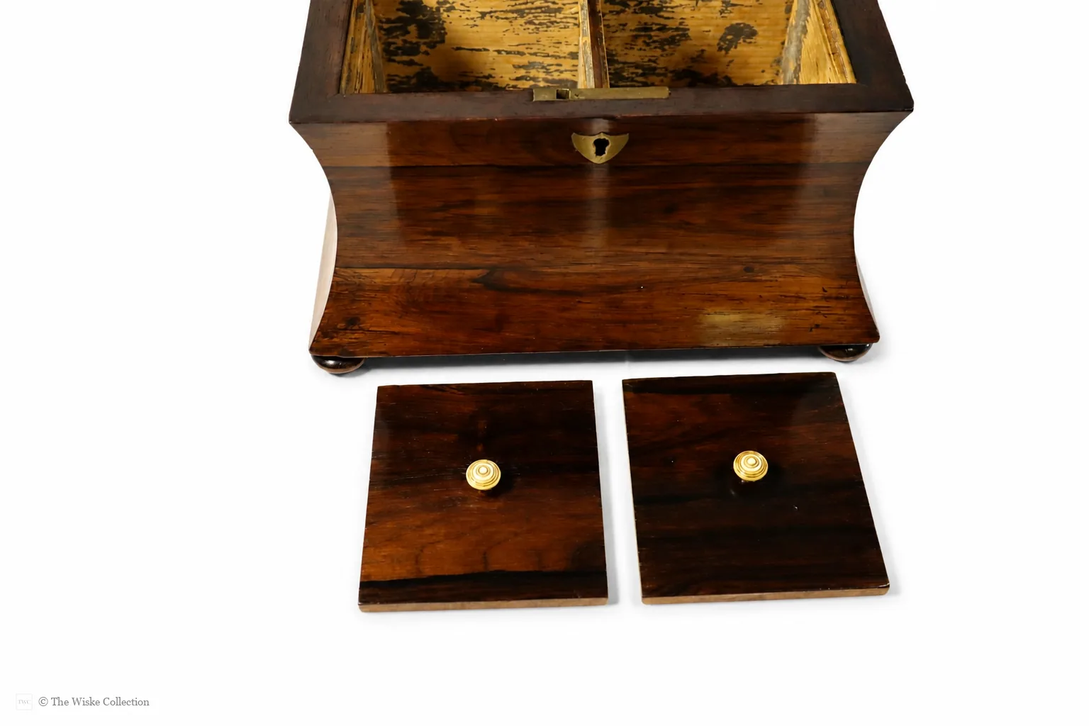 Early 19th-century rosewood tea caddy of waisted sarcophagus form, with twin compartments, brass keyplate, and compressed bun feet; 17cm high, 22cm wide thumbnail 7