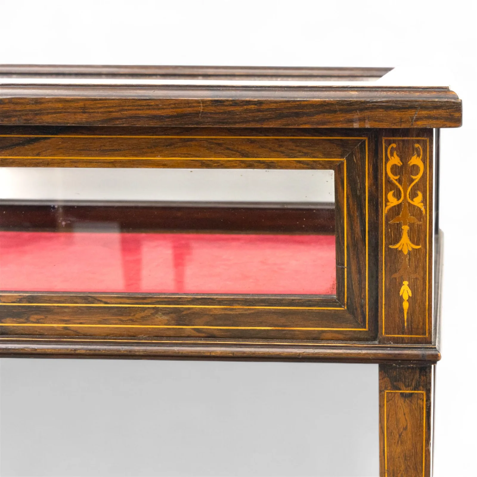 Edwardian rosewood bijouterie cabinet, the hinged rectangular top with line inlay enclosing a velvet lined interior, upon slender tapering legs inlaid with satinwood foliate marquetry decoration, with stretchers united by an under tier, raised on castors thumbnail 4