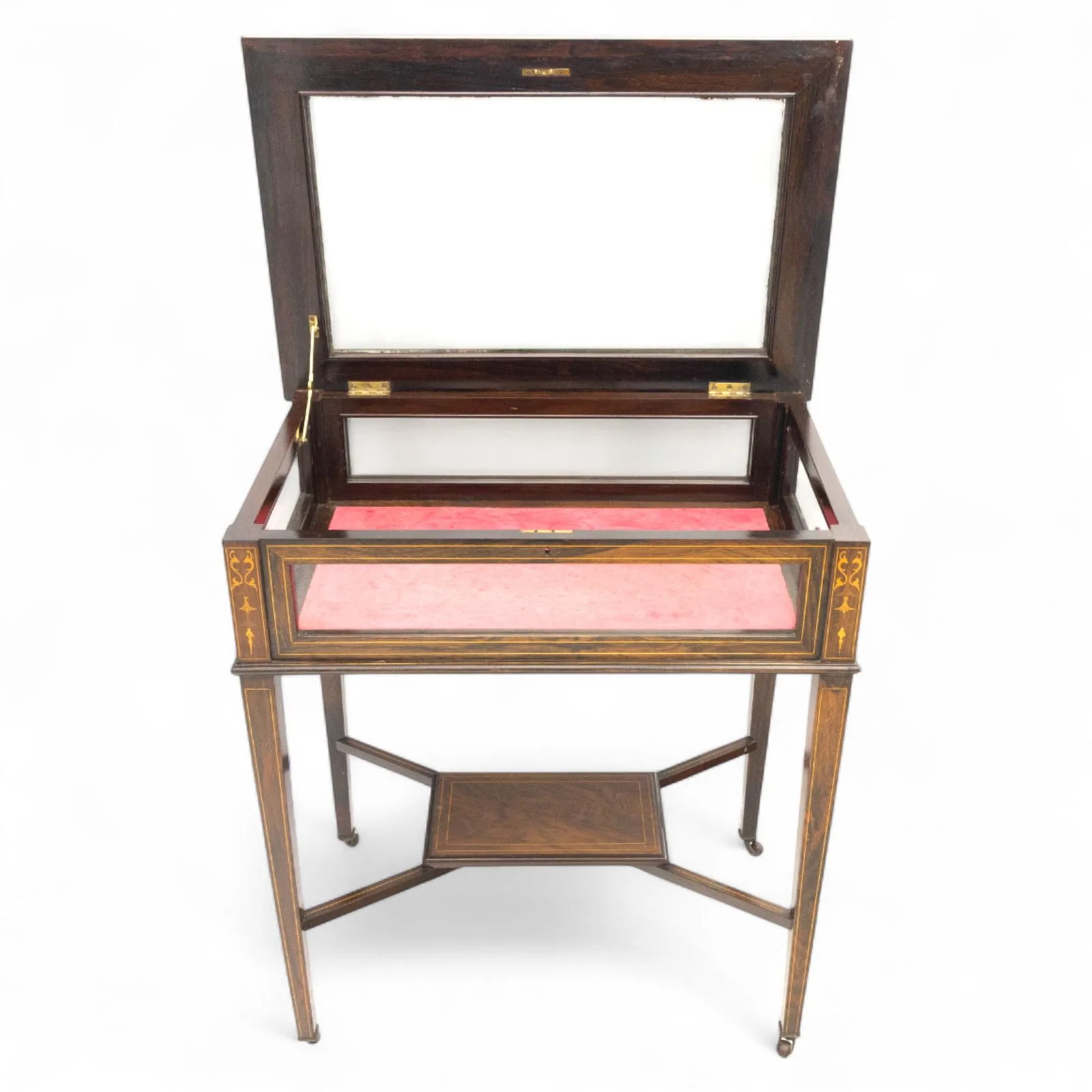 Edwardian rosewood bijouterie cabinet, the hinged rectangular top with line inlay enclosing a velvet lined interior, upon slender tapering legs inlaid with satinwood foliate marquetry decoration, with stretchers united by an under tier, raised on castors thumbnail 6