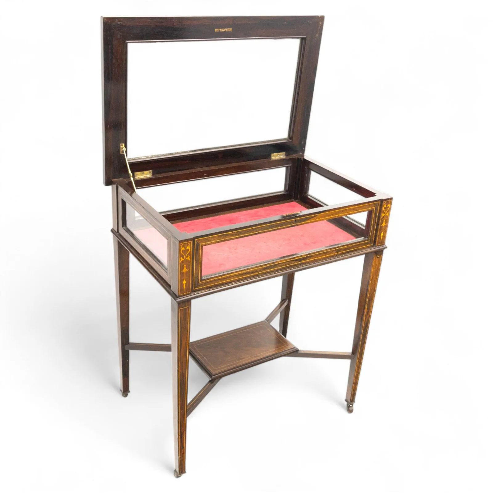 Edwardian rosewood bijouterie cabinet, the hinged rectangular top with line inlay enclosing a velvet lined interior, upon slender tapering legs inlaid with satinwood foliate marquetry decoration, with stretchers united by an under tier, raised on castors thumbnail 5