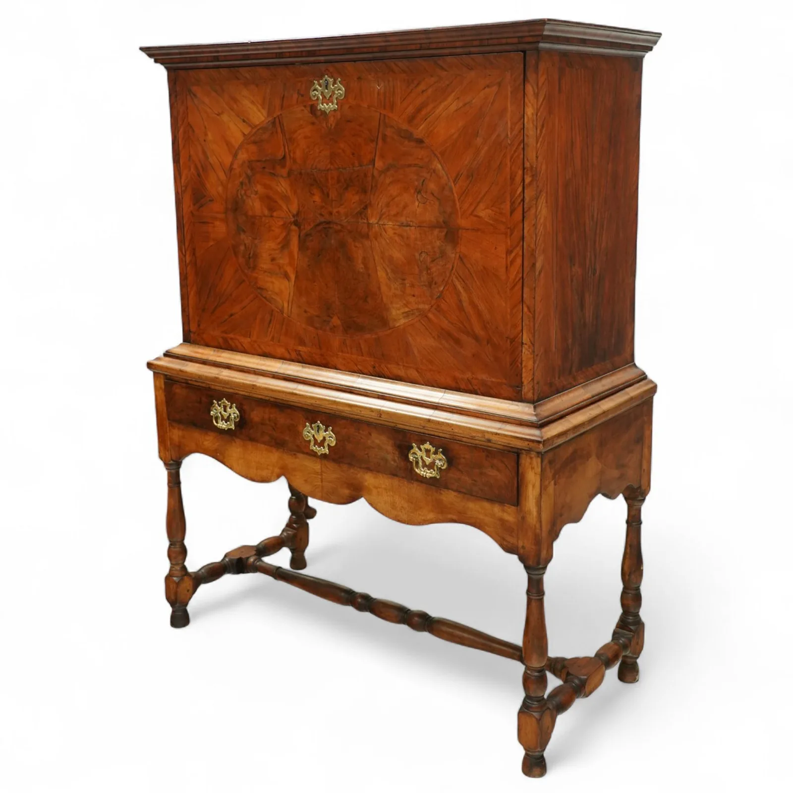 George I walnut bureau cabinet, early 18th century; moulded cornice, fall-front inlaid with oval burr-walnut panel, fitted drawers, pigeonholes and cupboard; baize-lined writing surface above long drawer; apron, turned legs and stretcher; later stand with brass strut supports; lacking key thumbnail 2