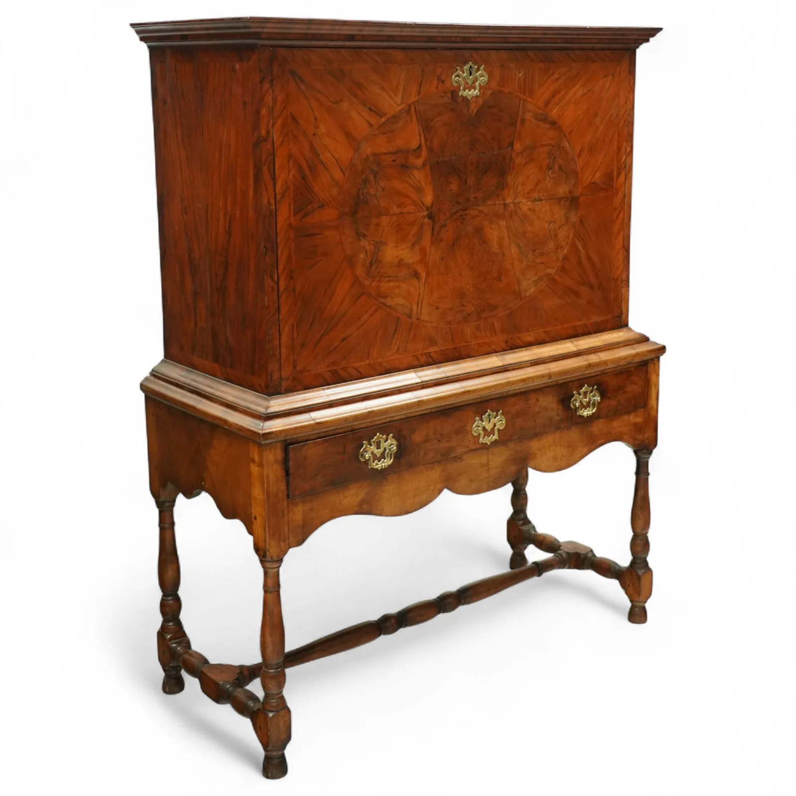 George I walnut bureau cabinet, early 18th century; moulded cornice, fall-front inlaid with oval burr-walnut panel, fitted drawers, pigeonholes and cupboard; baize-lined writing surface above long drawer; apron, turned legs and stretcher; later stand with brass strut supports; lacking key thumbnail 3
