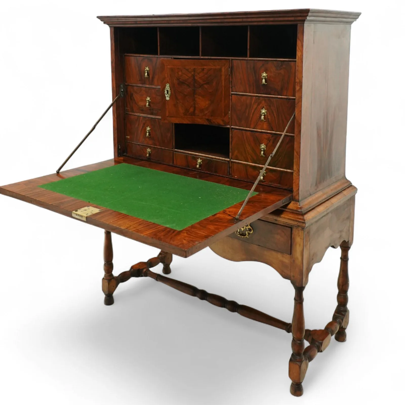 George I walnut bureau cabinet, early 18th century; moulded cornice, fall-front inlaid with oval burr-walnut panel, fitted drawers, pigeonholes and cupboard; baize-lined writing surface above long drawer; apron, turned legs and stretcher; later stand with brass strut supports; lacking key thumbnail 4