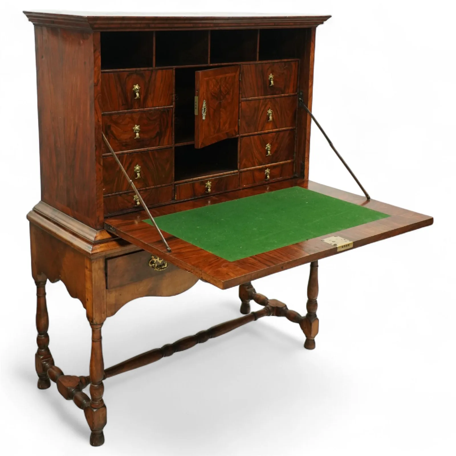 George I walnut bureau cabinet, early 18th century; moulded cornice, fall-front inlaid with oval burr-walnut panel, fitted drawers, pigeonholes and cupboard; baize-lined writing surface above long drawer; apron, turned legs and stretcher; later stand with brass strut supports; lacking key thumbnail 5