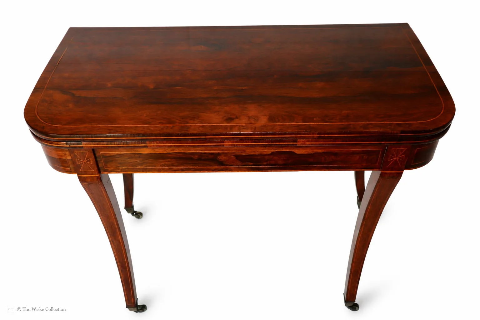 Beautiful Regency rosewood folding tea table, early 19th century, rounded rectangular top with satinwood banding and crossbanded frieze; hinged fold-over action; raised on tapered square supports with brass castors thumbnail 6