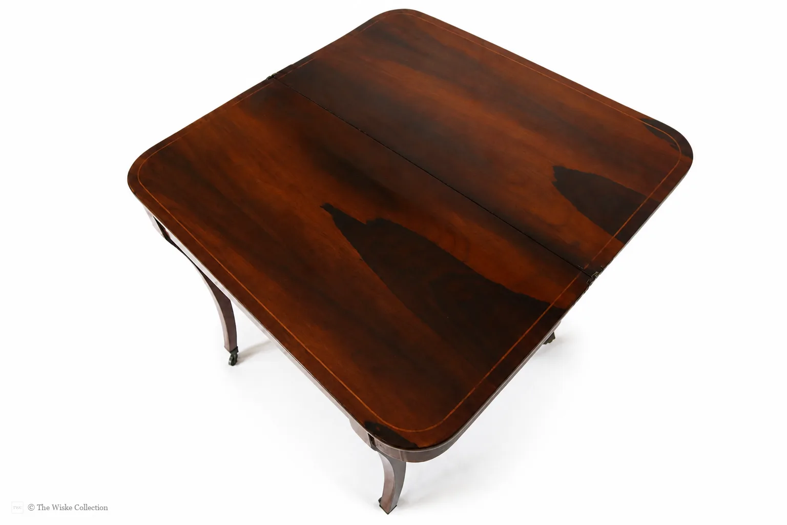 Beautiful Regency rosewood folding tea table, early 19th century, rounded rectangular top with satinwood banding and crossbanded frieze; hinged fold-over action; raised on tapered square supports with brass castors thumbnail 9