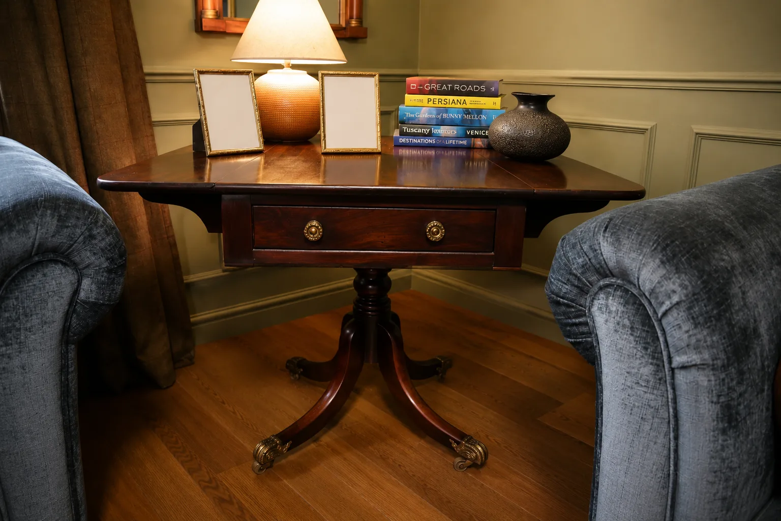 English late Regency mahogany drop-leaf Pembroke table, maker unknown, rectangular with rounded corners, frieze and blind drawers; raised on a turned pedestal with splayed legs ending in brass lion-paw feet and castors thumbnail 2