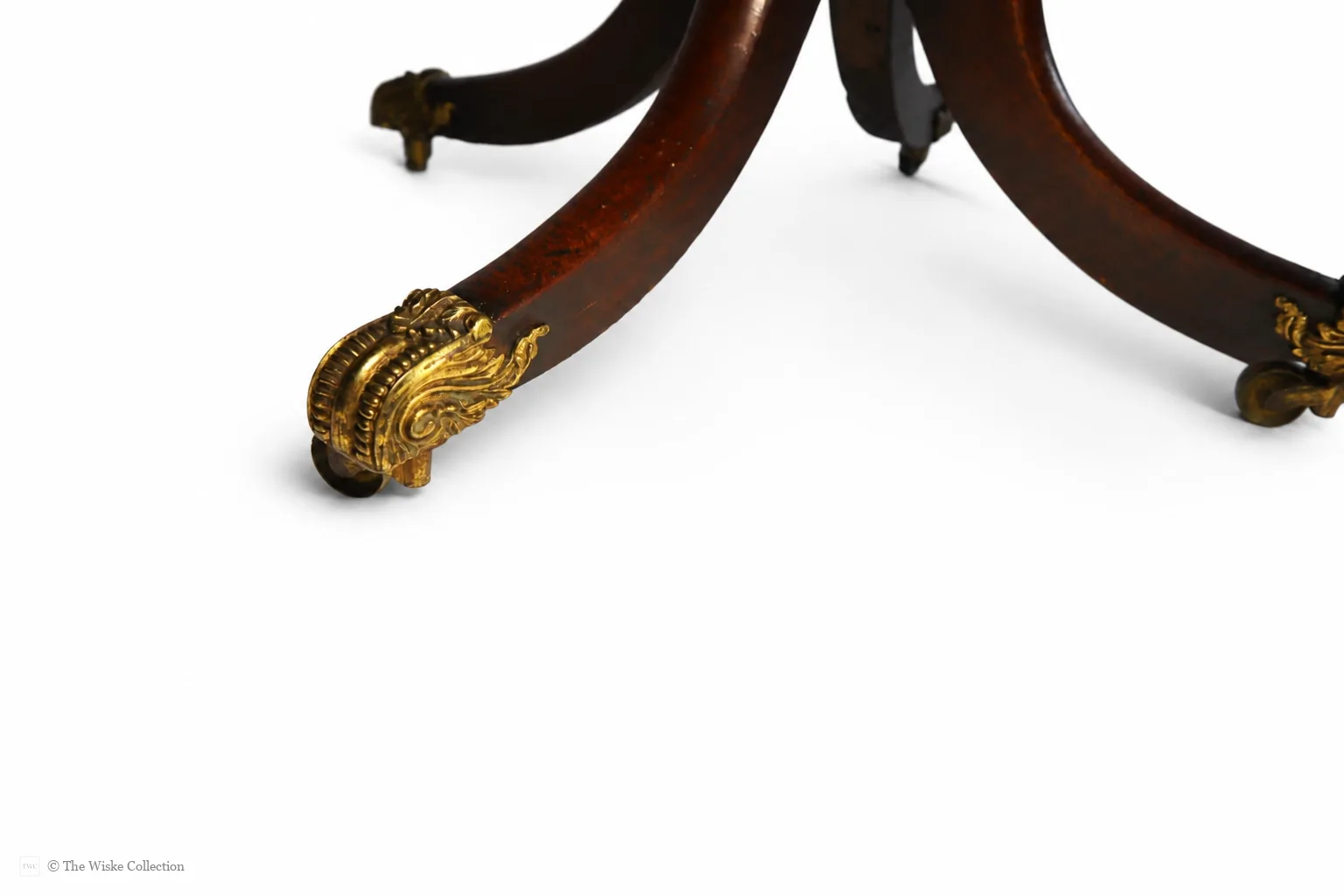 English late Regency mahogany drop-leaf Pembroke table, maker unknown, rectangular with rounded corners, frieze and blind drawers; raised on a turned pedestal with splayed legs ending in brass lion-paw feet and castors thumbnail 7
