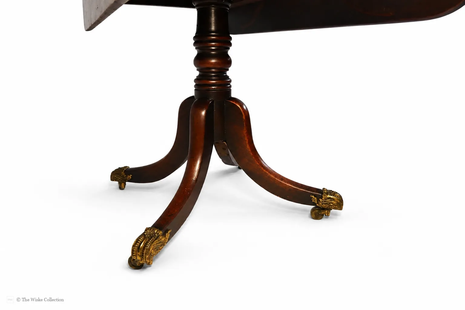 English late Regency mahogany drop-leaf Pembroke table, maker unknown, rectangular with rounded corners, frieze and blind drawers; raised on a turned pedestal with splayed legs ending in brass lion-paw feet and castors thumbnail 6