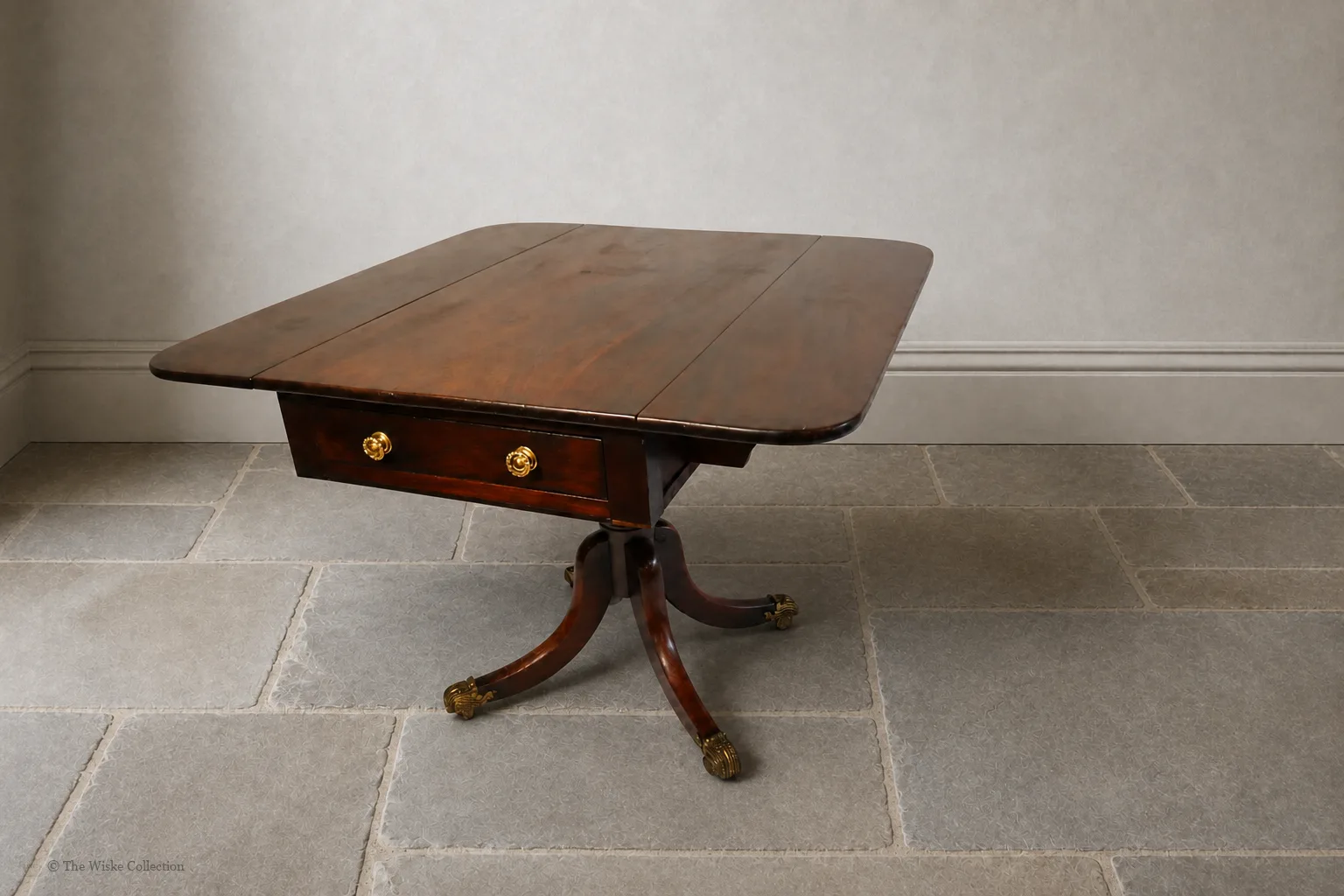 English late Regency mahogany drop-leaf Pembroke table, maker unknown, rectangular with rounded corners, frieze and blind drawers; raised on a turned pedestal with splayed legs ending in brass lion-paw feet and castors thumbnail 8