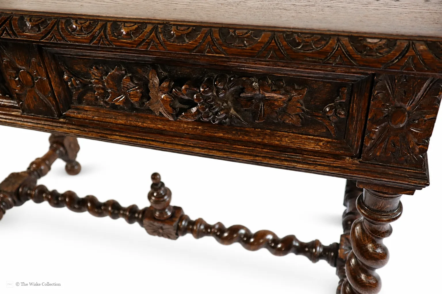 Victorian carved oak side table with solid moulded and carved rectangular top, deep frieze of foliate-carved twin drawers flanking a central panel, on barley-twist legs united by a shaped stretcher with turned knop, ending in block feet thumbnail 8