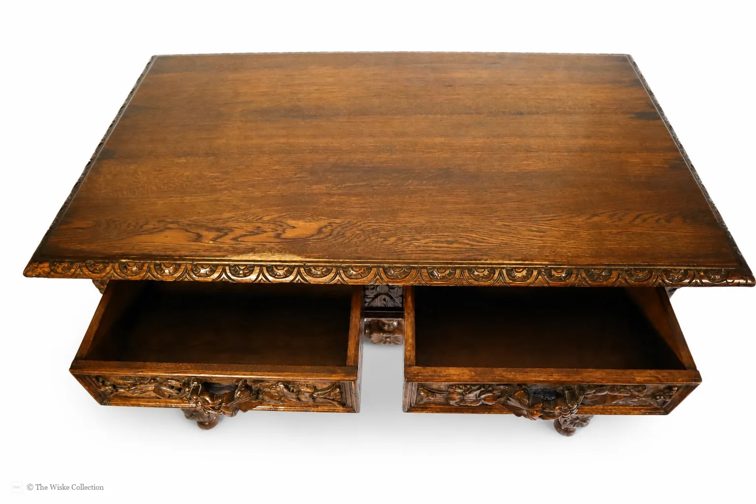 Victorian carved oak side table with solid moulded and carved rectangular top, deep frieze of foliate-carved twin drawers flanking a central panel, on barley-twist legs united by a shaped stretcher with turned knop, ending in block feet thumbnail 9