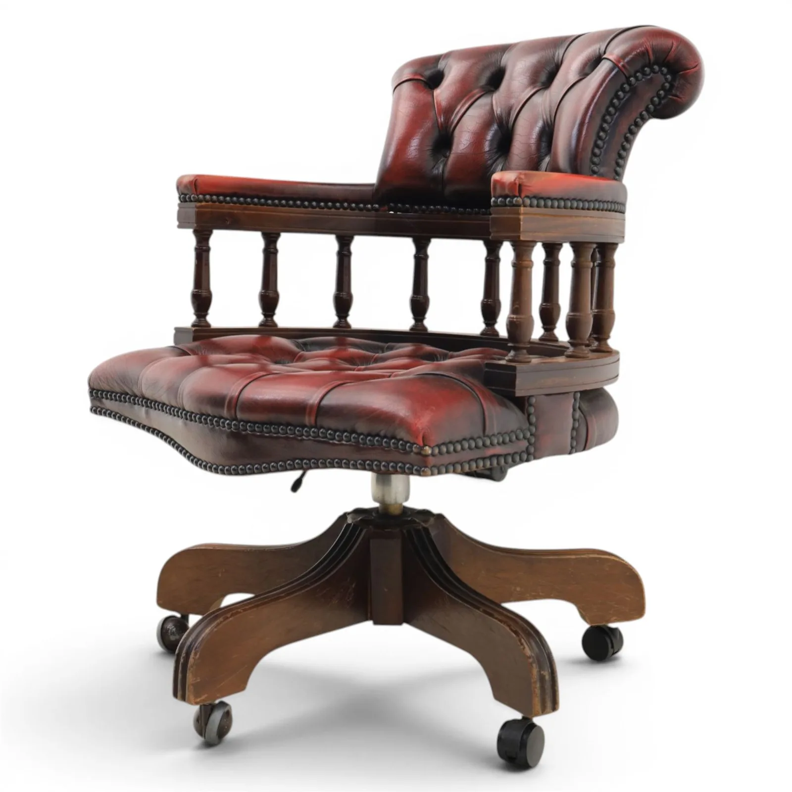 Captains swivel desk chair upholstered in oxblood leather, buttoned back and seat, shaped arm bow raised on turned spindles, five spoke base raised on castors thumbnail 3