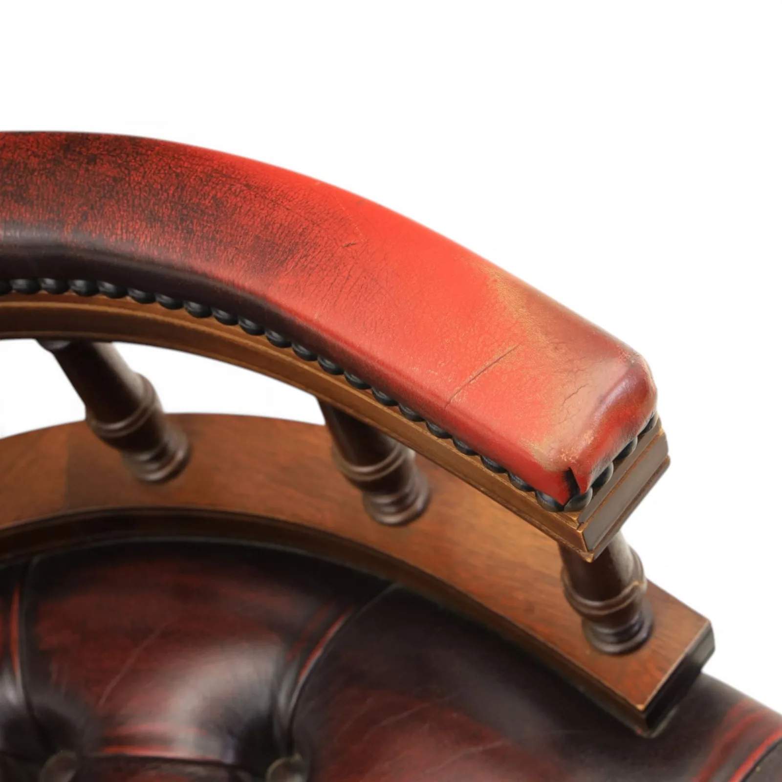 Captains swivel desk chair upholstered in oxblood leather, buttoned back and seat, shaped arm bow raised on turned spindles, five spoke base raised on castors thumbnail 7