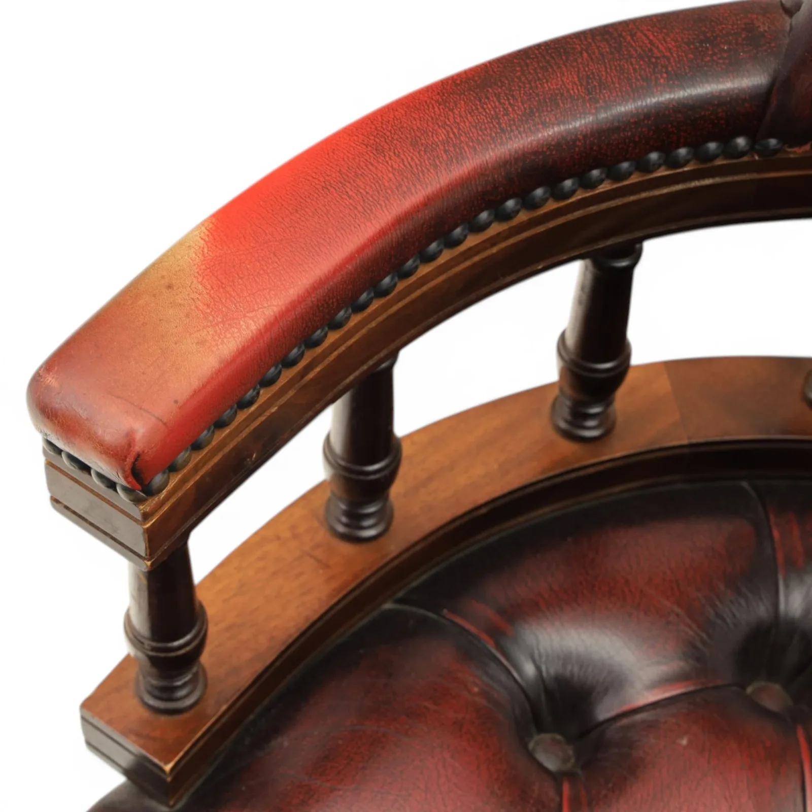 Captains swivel desk chair upholstered in oxblood leather, buttoned back and seat, shaped arm bow raised on turned spindles, five spoke base raised on castors thumbnail 8