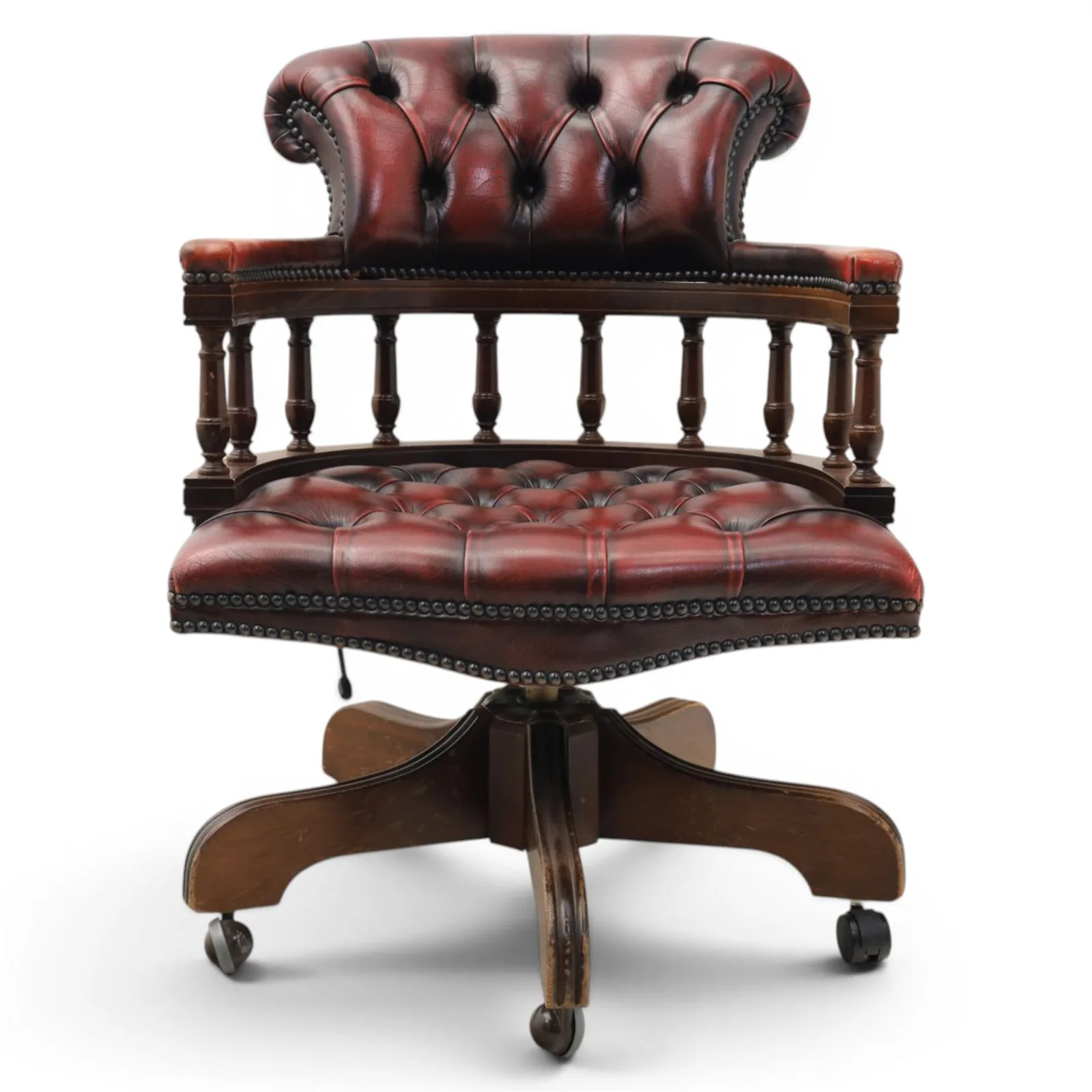 Captains swivel desk chair upholstered in oxblood leather, buttoned back and seat, shaped arm bow raised on turned spindles, five spoke base raised on castors thumbnail 2