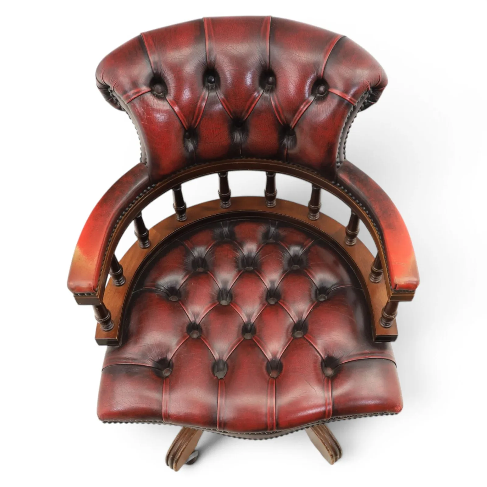 Captains swivel desk chair upholstered in oxblood leather, buttoned back and seat, shaped arm bow raised on turned spindles, five spoke base raised on castors thumbnail 5